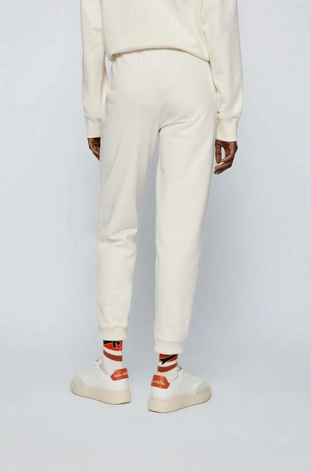 Boss Jogginghose »X RUSSELL ATHLETIC Jogginghose C_Ejoy_RA« Naturweiß (118), Grau (040), Orange (821) 5 Boss Jogginghose »X RUSSELL ATHLETIC Jogginghose C_Ejoy_RA« Naturweiß (118), Grau (040), Orange (821) – Bild 5