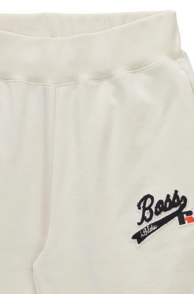 Boss Jogginghose »X RUSSELL ATHLETIC Jogginghose C_Ejoy_RA« Naturweiß (118), Grau (040), Orange (821) 2 Boss Jogginghose »X RUSSELL ATHLETIC Jogginghose C_Ejoy_RA« Naturweiß (118), Grau (040), Orange (821) – Bild 2